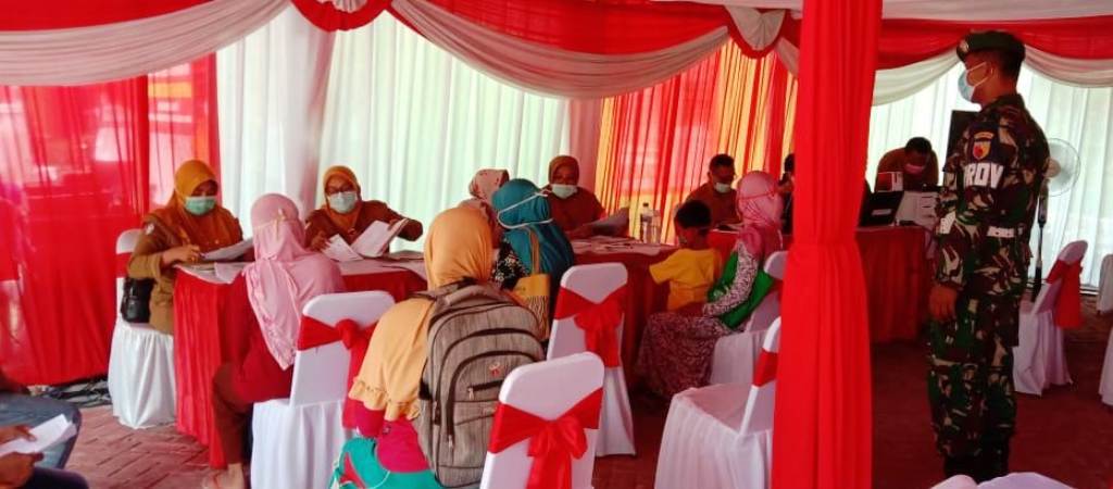 Pelayanan Dukcapil Dilokasi TMMD Kodim Bojonegoro Tetap Terapkan Protokol Kesehatan