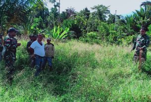 Satgas TMMD Pasang Patok Pembangunan Balai Kampung Dorba