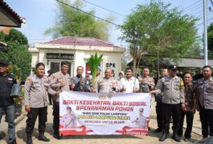 Polres Lampung Utara Gelar Bansos dan Penananaman Pohon
