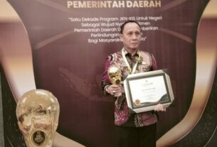 Pj. Bupati Lampung Utara Terima Penghargaan Universal Health Coverage Jakarta